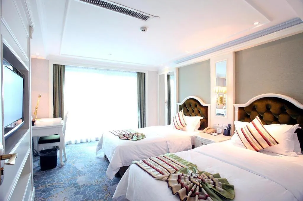 Bed in Xiamen Jingmin Central Hotel