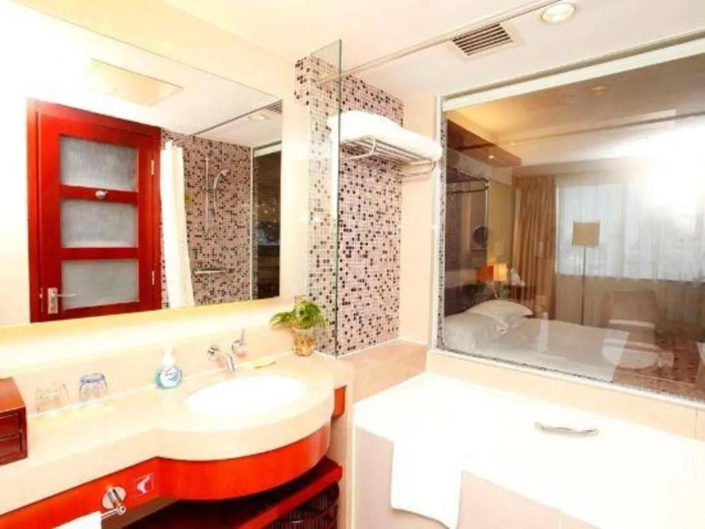 Bed in Xiamen Jingmin Central Hotel