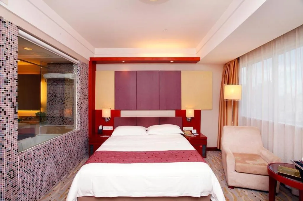 Bed in Xiamen Jingmin Central Hotel