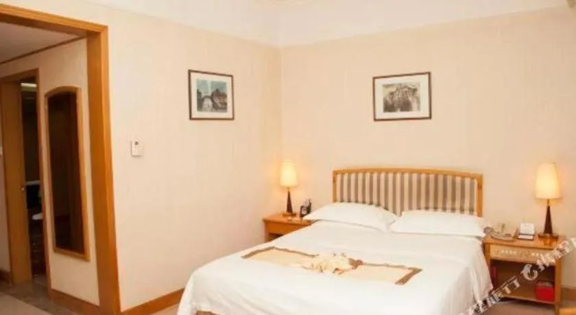 Bed in Xiamen Jingmin Central Hotel