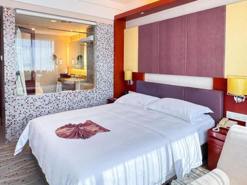 Bed in Xiamen Jingmin Central Hotel