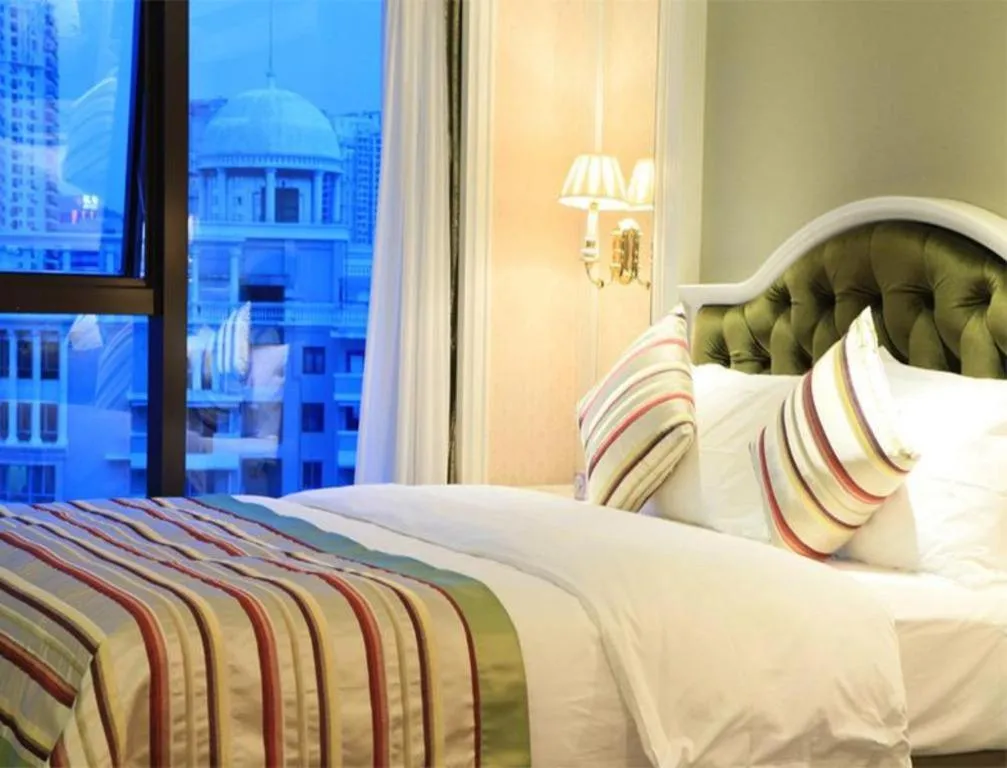 Bed in Xiamen Jingmin Central Hotel