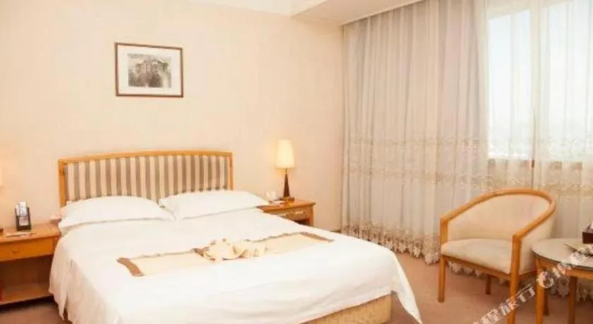 Bed in Xiamen Jingmin Central Hotel