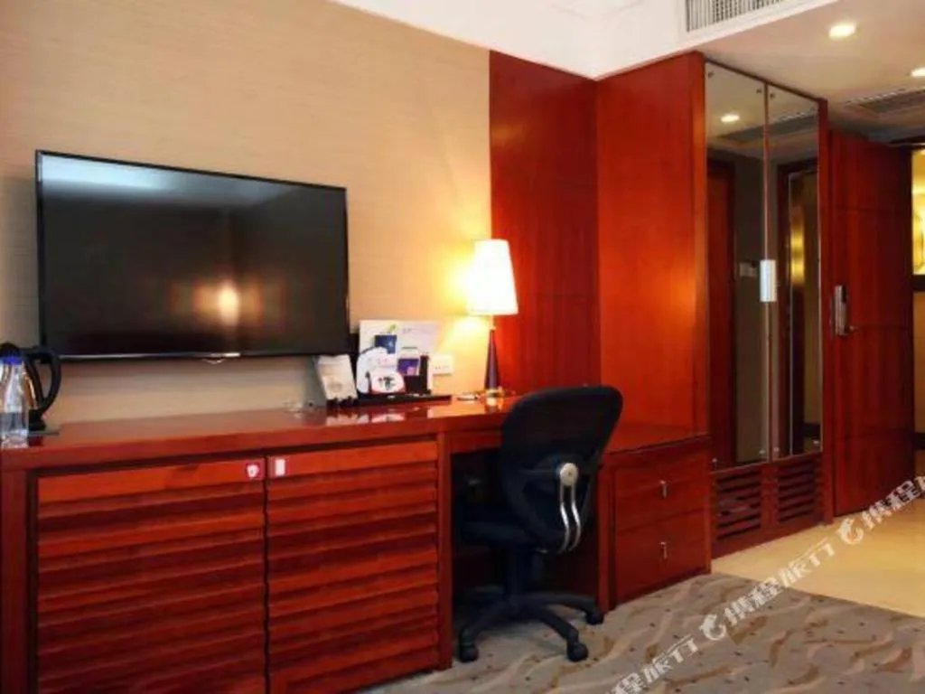 Bed in Xiamen Jingmin Central Hotel