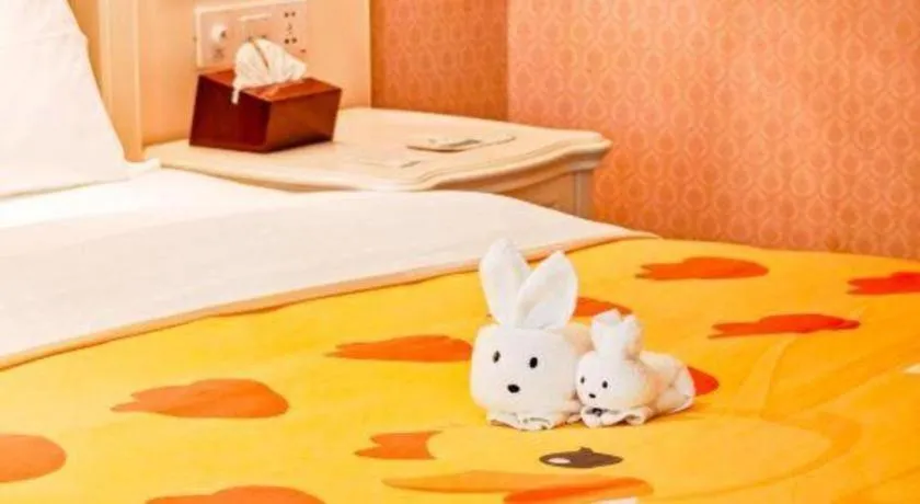 Bed in Xiamen Jingmin Central Hotel