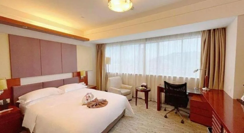 Bed in Xiamen Jingmin Central Hotel