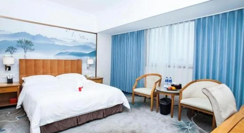 Bed in Xiamen Jingmin Central Hotel