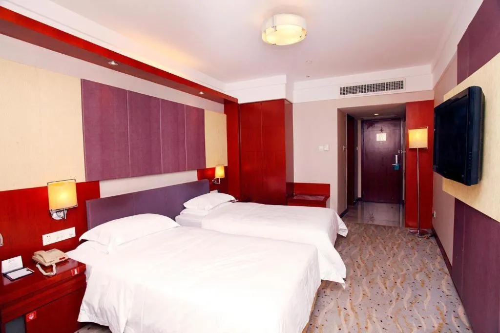 Bed in Xiamen Jingmin Central Hotel