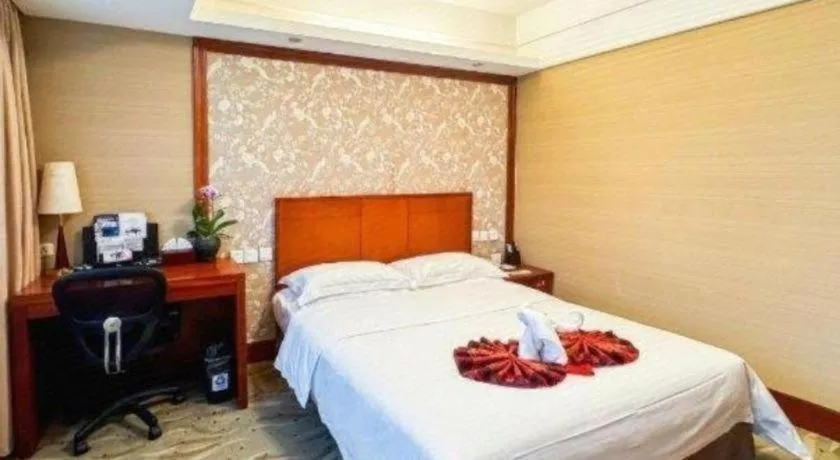Bed in Xiamen Jingmin Central Hotel