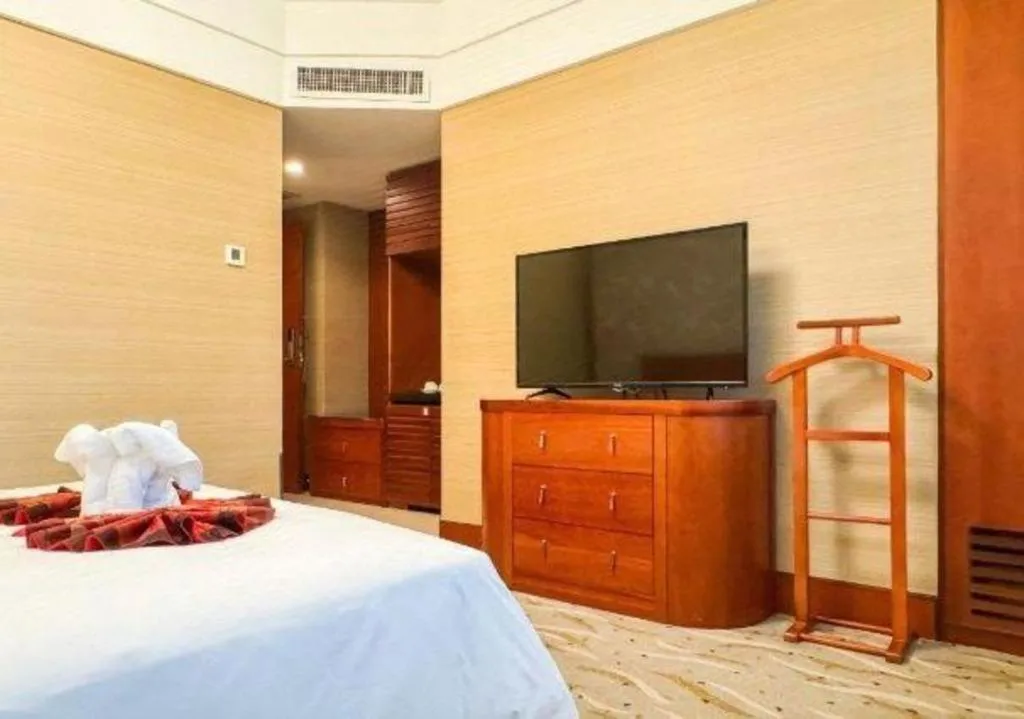 Bed in Xiamen Jingmin Central Hotel