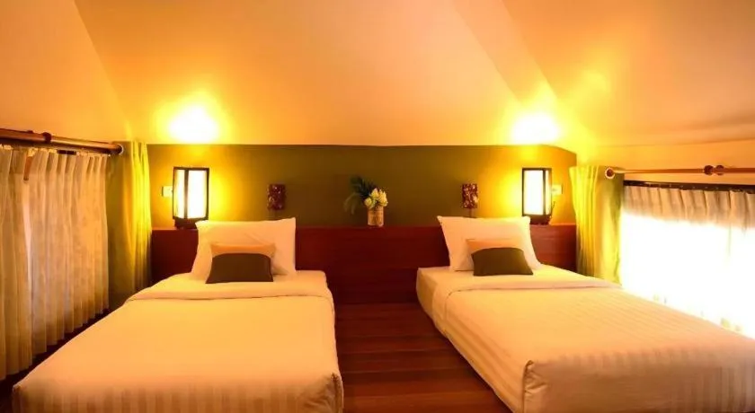 Bed in Baan Talay Dao Resort