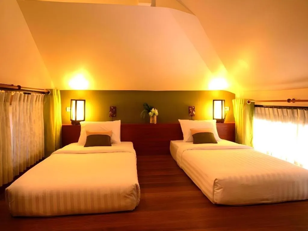 Bed in Baan Talay Dao Resort