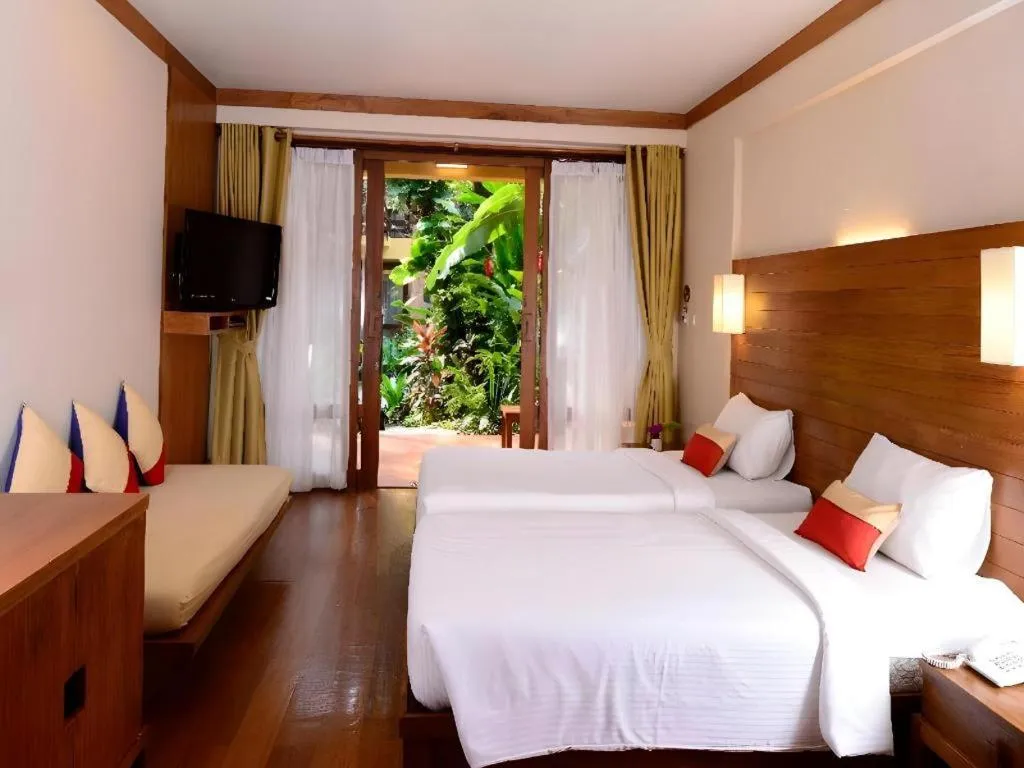 Bed in Baan Talay Dao Resort
