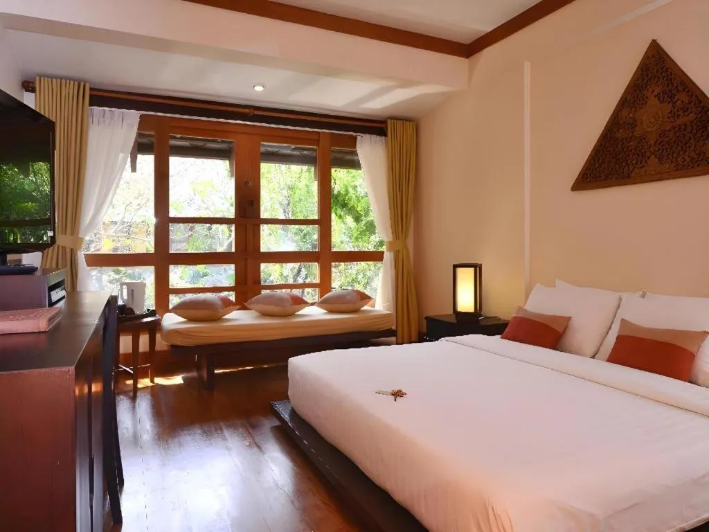 Bed in Baan Talay Dao Resort