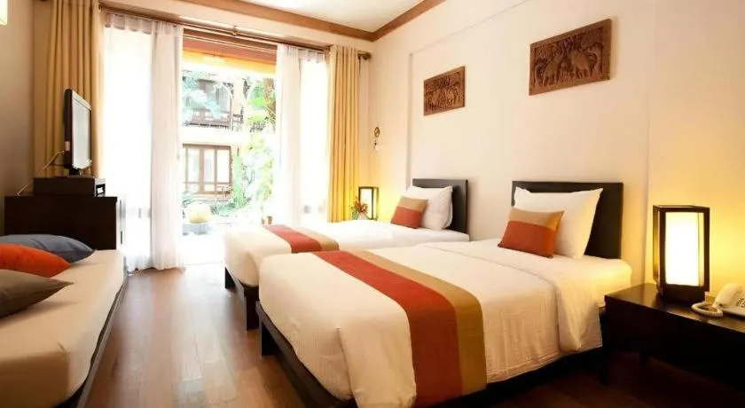 Bed in Baan Talay Dao Resort
