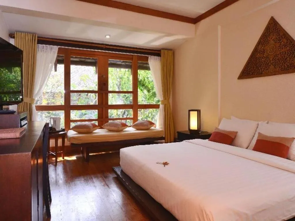 Bed in Baan Talay Dao Resort