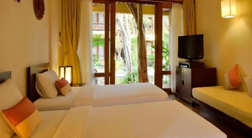 Bed in Baan Talay Dao Resort