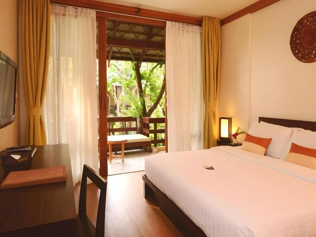 Bed in Baan Talay Dao Resort