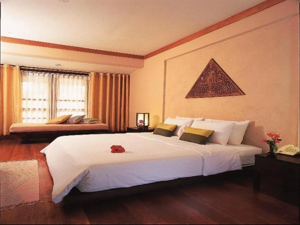 Bed in Baan Talay Dao Resort