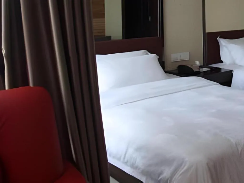 Bed in Milu Hotel