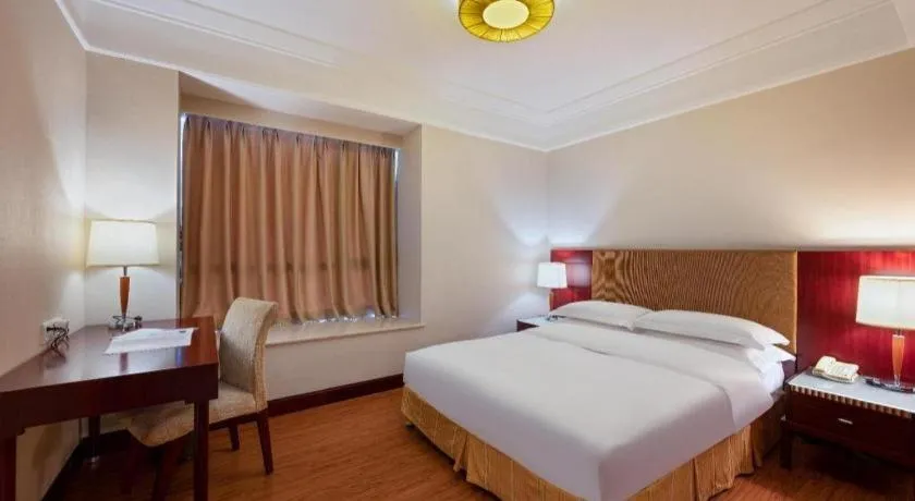 Bed in Golden Diamond Hotel Zhongshan