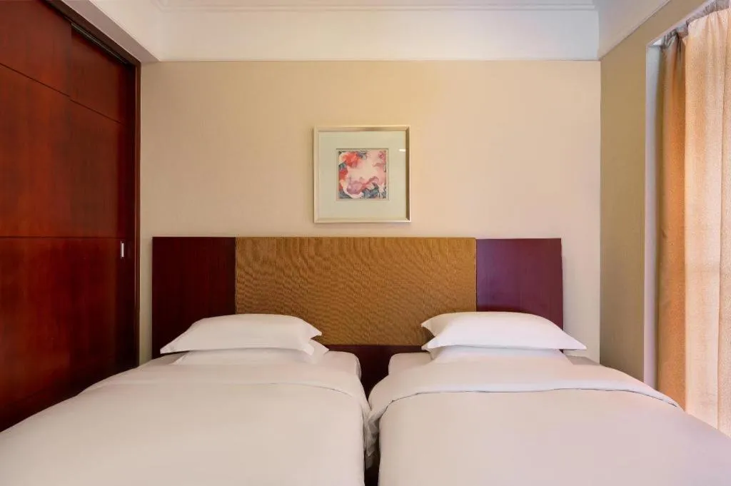 Bed in Golden Diamond Hotel Zhongshan