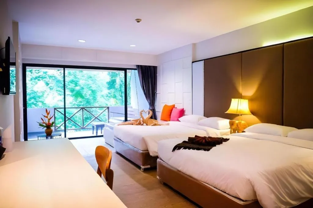 Bed in River Kwai Village Hotel