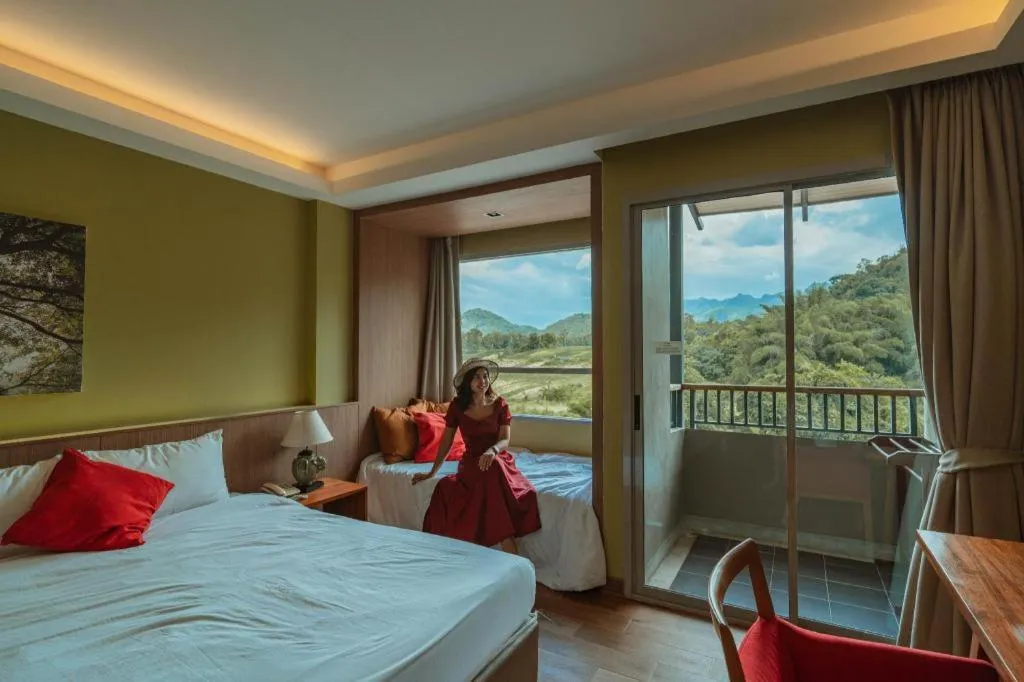 Bed in River Kwai Village Hotel