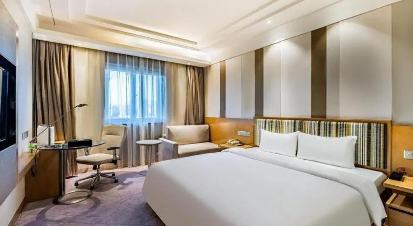 Bed in Grand Skylight Catic Hotel