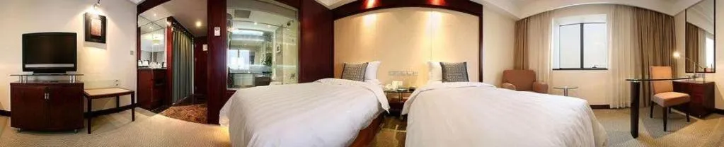 Bed in Grand Skylight Catic Hotel