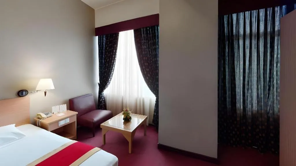 Bed in Great Eastern Hotel Quezon City