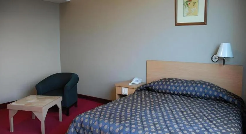 Bed in Great Eastern Hotel Quezon City