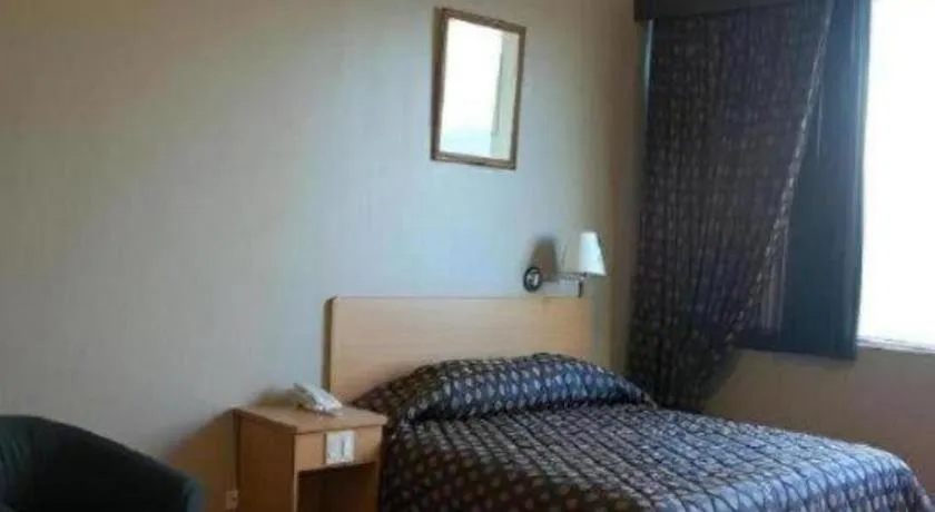 Bed in Great Eastern Hotel Quezon City