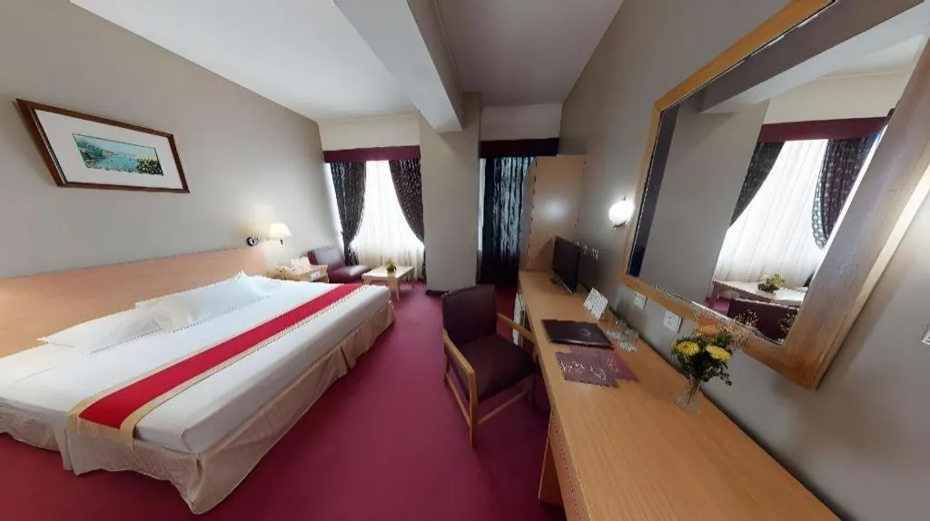 Bed in Great Eastern Hotel Quezon City