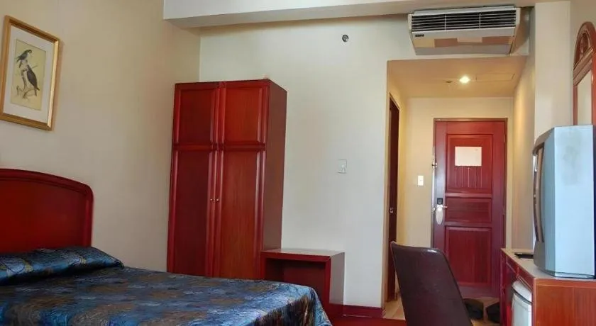 Bed in Great Eastern Hotel Quezon City