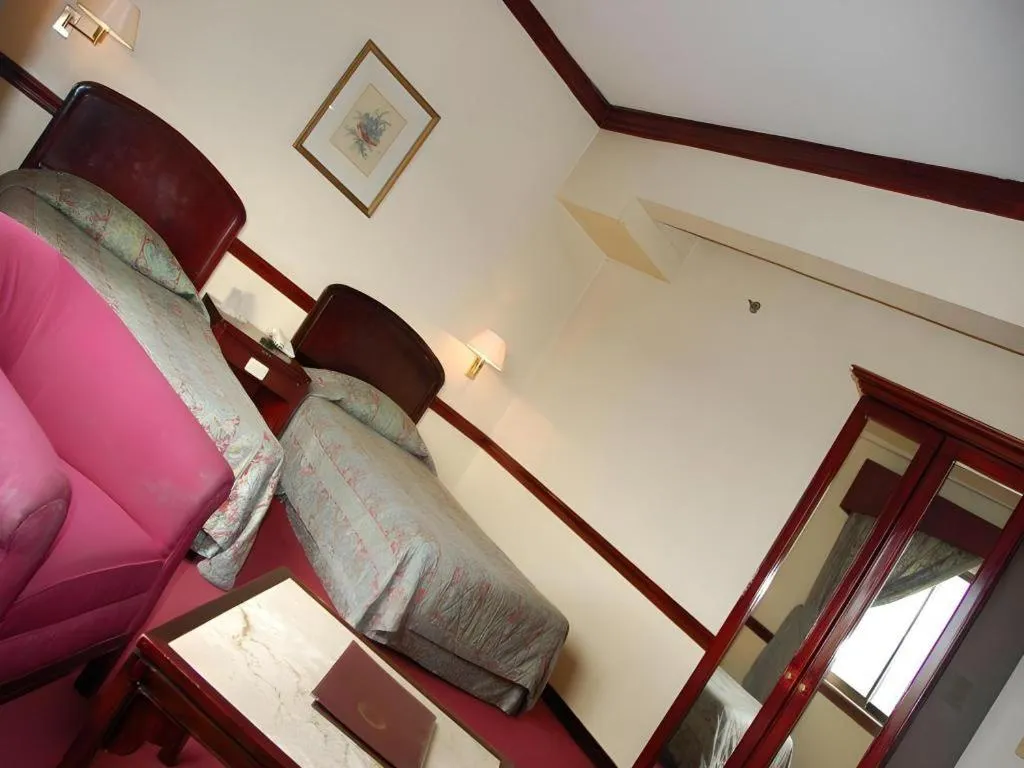 Bed in Great Eastern Hotel Quezon City