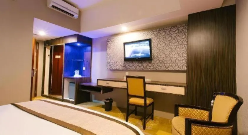 Bed in Hermes Palace Hotel Medan