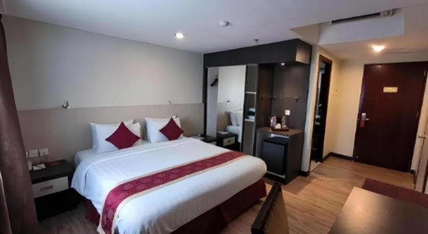 Bed in Hermes Palace Hotel Medan