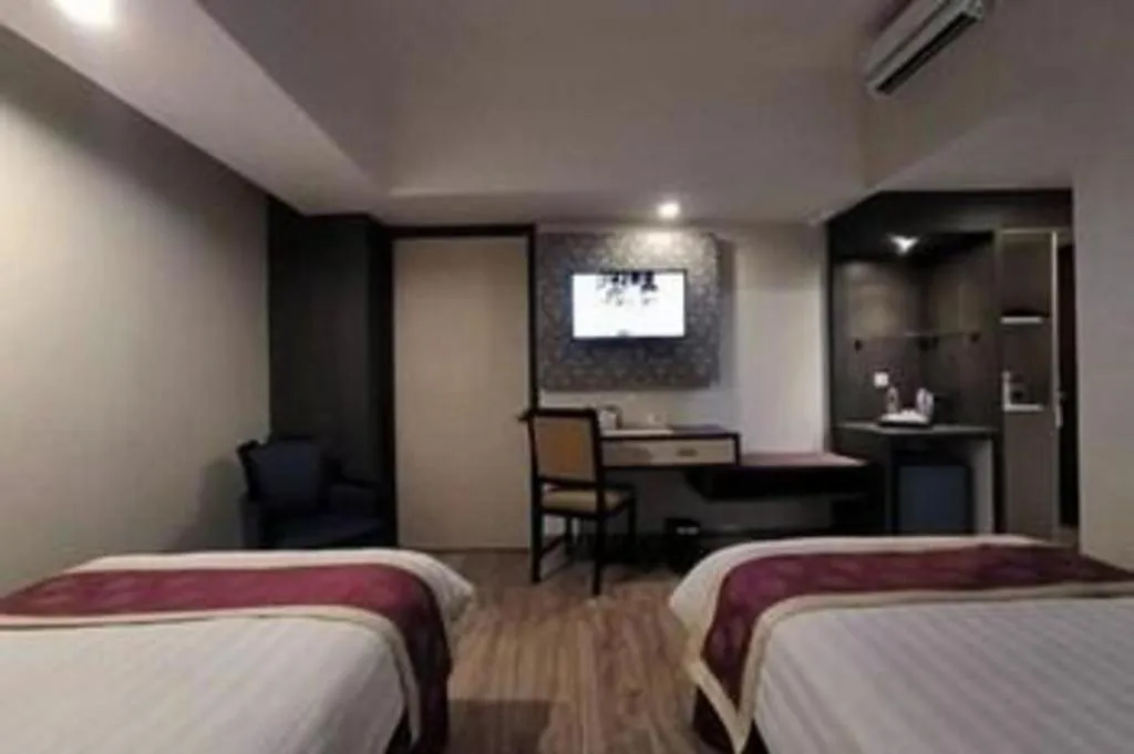 Bed in Hermes Palace Hotel Medan