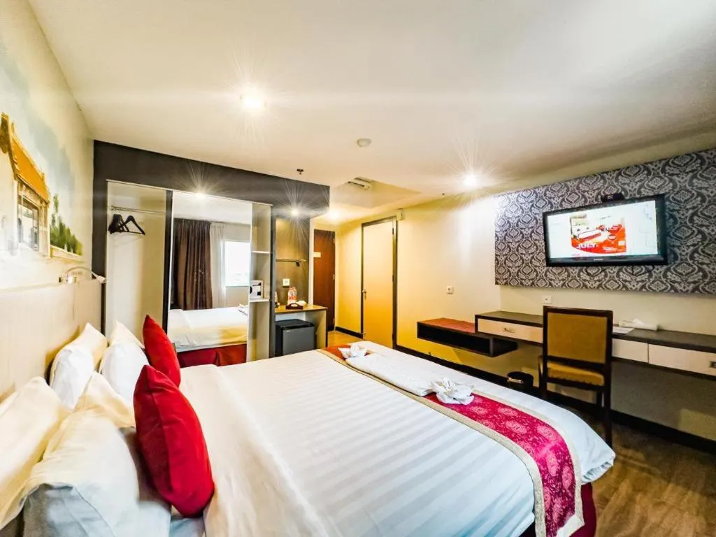 Bed in Hermes Palace Hotel Medan