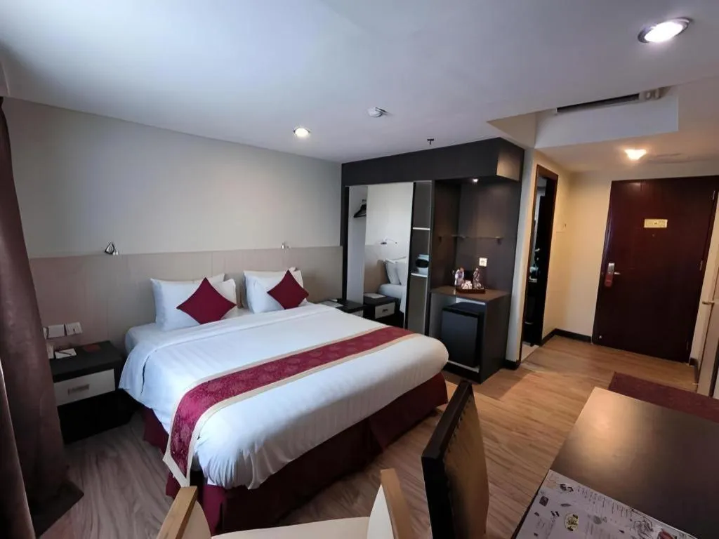 Bed in Hermes Palace Hotel Medan