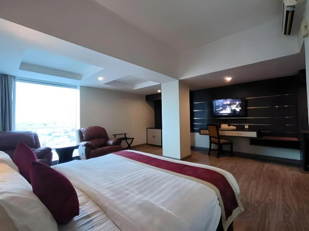 Bed in Hermes Palace Hotel Medan