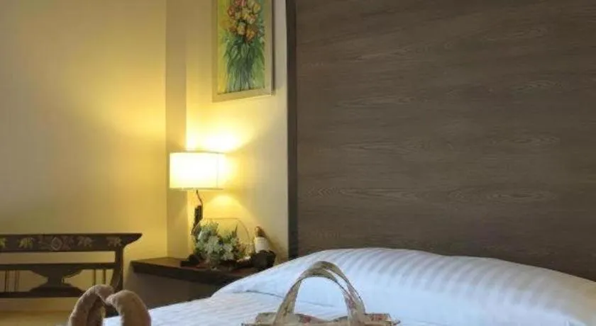 Bed in Red Balcony Hotel