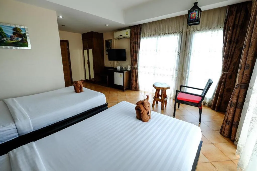 Bed in Red Balcony Hotel