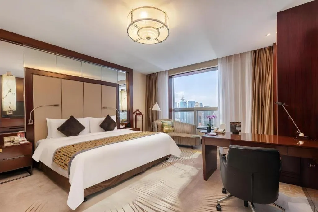 Bed in Grand Soluxe Zhongyou Hotel