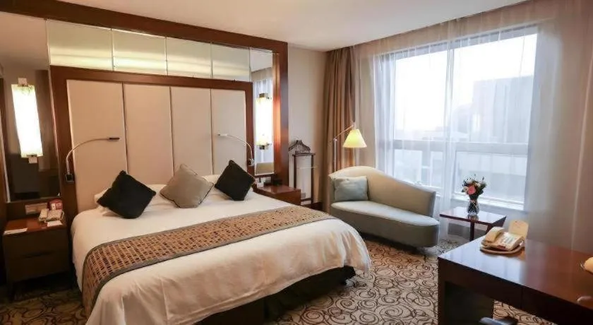 Bed in Grand Soluxe Zhongyou Hotel