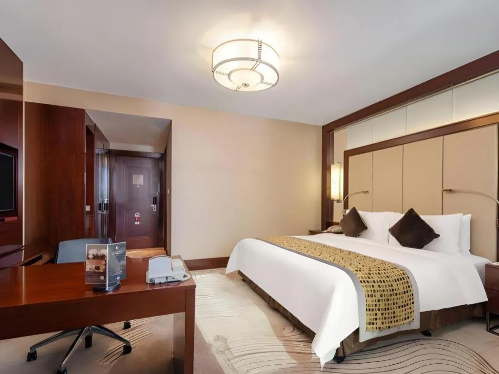 Bed in Grand Soluxe Zhongyou Hotel
