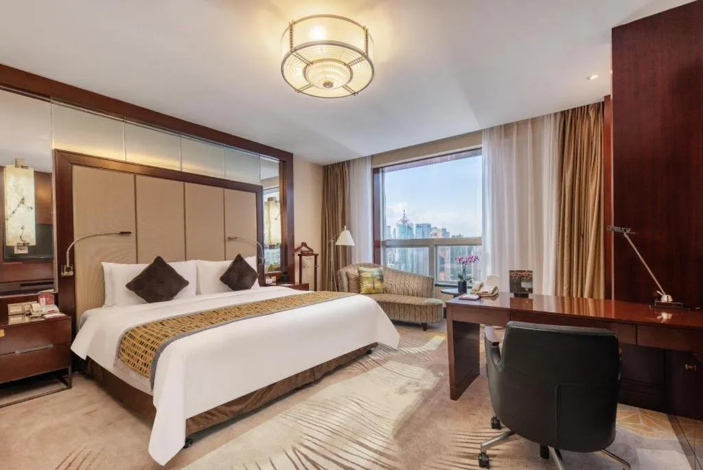 Bed in Grand Soluxe Zhongyou Hotel