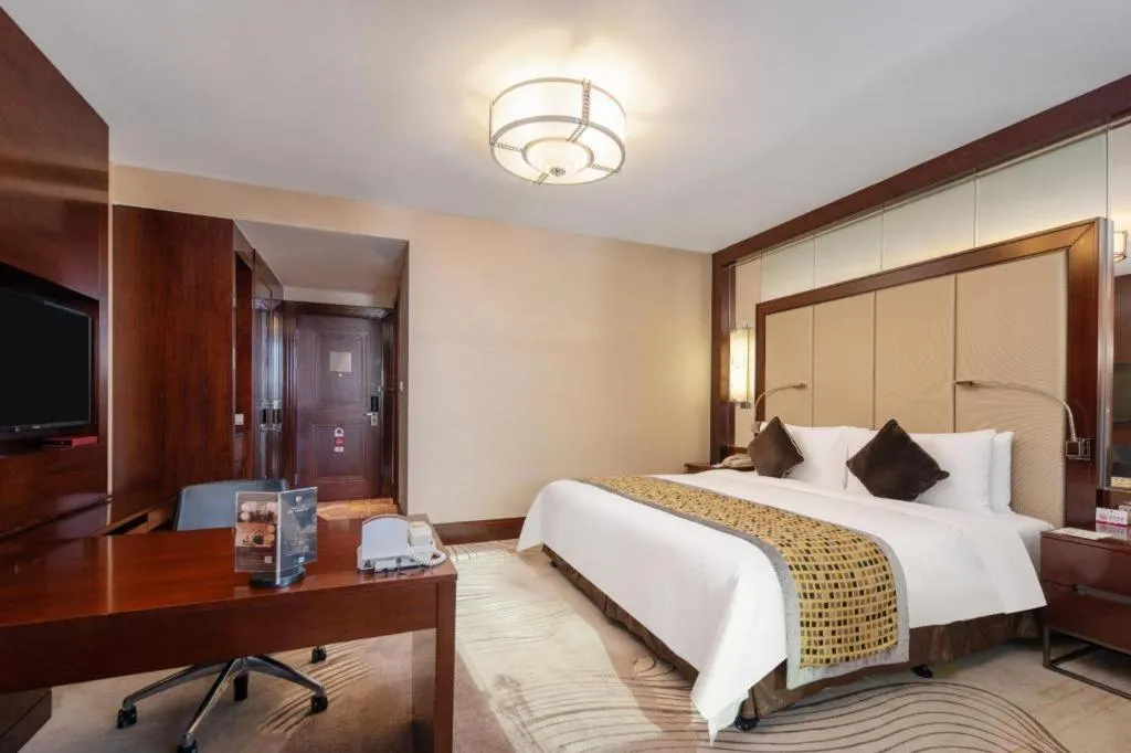 Bed in Grand Soluxe Zhongyou Hotel