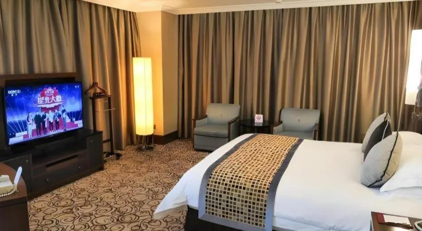 Bed in Grand Soluxe Zhongyou Hotel